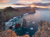 Madera, Portugalia, Zachód słońca, Wybrzeże, Klify, Chmury, Morze, Skały